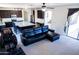 Open living room, sectional sofa, and island kitchen view at 25696 W Williams Ct, Buckeye, AZ 85326