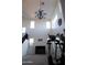 Two-story living area with large windows and a chandelier at 25696 W Williams Ct, Buckeye, AZ 85326