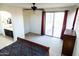 Main bedroom with wood sleigh bed, access to bathroom and patio at 25696 W Williams Ct, Buckeye, AZ 85326