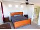 Large main bedroom with wood furniture and private access to patio at 25696 W Williams Ct, Buckeye, AZ 85326