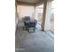 Covered patio with outdoor dining set and built-in grill at 25696 W Williams Ct, Buckeye, AZ 85326
