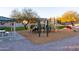 Community playground with play structures, swings, and covered picnic area at 25696 W Williams Ct, Buckeye, AZ 85326