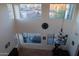 Two-story entry with wall of windows, backyard view, and chandelier at 25696 W Williams Ct, Buckeye, AZ 85326