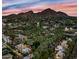 Beautiful aerial view of the community homes with palm trees and mountain views at sunset at 4540 N 44Th St # 41, Phoenix, AZ 85018