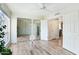 Bright bedroom with mirrored closet doors and wood-look flooring at 4540 N 44Th St # 41, Phoenix, AZ 85018