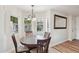 Cozy dining room featuring natural light, wood floors, and a decorative chandelier at 4540 N 44Th St # 41, Phoenix, AZ 85018