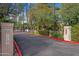 Private community entrance featuring manicured landscaping and a secure, welcoming environment at 4540 N 44Th St # 41, Phoenix, AZ 85018