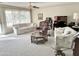 Relaxing living room with ample seating and large windows at 10207 W Oak Ridge Dr, Sun City, AZ 85351