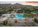 Community pool and spa with mountain views and lounge chairs at 10671 E Caribbean Ln, Scottsdale, AZ 85255