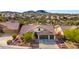 Single-story home with a two-car garage and desert landscaping at 10812 S Coolwater Dr, Goodyear, AZ 85338