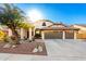 Beautiful desert home with 2-car garage, mature landscaping, and a long driveway at 10812 S Coolwater Dr, Goodyear, AZ 85338