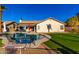 Relaxing pool and putting green in sunny backyard at 10812 S Coolwater Dr, Goodyear, AZ 85338