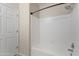 Bathroom shower featuring white subway tile and neutral walls at 14575 W Mountain View Blvd # 11317, Surprise, AZ 85374