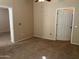 Bright bedroom with ceiling fan and door to hallway at 14575 W Mountain View Blvd # 11317, Surprise, AZ 85374