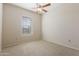 Bedroom with a window and neutral carpeting at 14575 W Mountain View Blvd # 11317, Surprise, AZ 85374