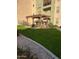 Relaxing community patio with pergola, picnic tables, and grill at 14575 W Mountain View Blvd # 11317, Surprise, AZ 85374