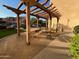 Outdoor pergola with picnic tables and benches at 14575 W Mountain View Blvd # 11317, Surprise, AZ 85374