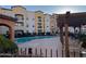 Inviting community pool with lounge chairs and building view at 14575 W Mountain View Blvd # 11317, Surprise, AZ 85374