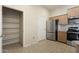 Spacious kitchen with stainless steel appliances, granite countertops, and pantry storage at 14575 W Mountain View Blvd # 11317, Surprise, AZ 85374