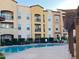 Inviting community pool with apartment building in background at 14575 W Mountain View Blvd # 11317, Surprise, AZ 85374