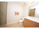 Bathroom featuring a tiled shower, toilet, and single sink vanity with storage at 16 W Encanto Blvd # 609, Phoenix, AZ 85003