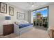 Guest bedroom with daybed, balcony access, and city views at 16 W Encanto Blvd # 609, Phoenix, AZ 85003