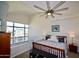 Stylish bedroom features a ceiling fan, large windows and a decorative bed frame at 16 W Encanto Blvd # 609, Phoenix, AZ 85003