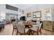 Bright dining area with wood table and gray chairs, adjacent to kitchen at 16 W Encanto Blvd # 609, Phoenix, AZ 85003