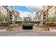 Condo building exterior with gated parking and landscaping at 16 W Encanto Blvd # 609, Phoenix, AZ 85003