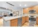 Modern kitchen open to living area with island and stainless steel appliances at 16 W Encanto Blvd # 609, Phoenix, AZ 85003