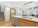 Modern kitchen with island, stainless steel appliances and staircase view at 16 W Encanto Blvd # 609, Phoenix, AZ 85003