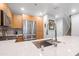Modern kitchen with island, stainless steel appliances, and a view to the living room at 16 W Encanto Blvd # 609, Phoenix, AZ 85003