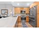 Modern kitchen with stainless steel appliances and quartz countertops at 16 W Encanto Blvd # 609, Phoenix, AZ 85003