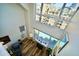 Top-down view of a living room showcasing fireplace, balcony, and expansive windows at 16 W Encanto Blvd # 609, Phoenix, AZ 85003