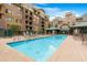 Community pool with plenty of lounge chairs for relaxing at 16 W Encanto Blvd # 609, Phoenix, AZ 85003