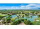 Aerial view of community with lake and golf course at 18626 E Amarado Cir, Rio Verde, AZ 85263
