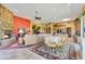Open floor plan with a dining area, living room, and stone fireplace at 18626 E Amarado Cir, Rio Verde, AZ 85263