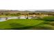 Scenic golf course view with lake and mountain backdrop at 18626 E Amarado Cir, Rio Verde, AZ 85263