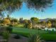 Putting green next to lake with desert landscape at 18626 E Amarado Cir, Rio Verde, AZ 85263