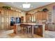 Gourmet kitchen with an island, stainless steel appliances, and custom cabinetry at 18626 E Amarado Cir, Rio Verde, AZ 85263