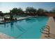 Community pool with lounge chairs and landscaping at 18626 E Amarado Cir, Rio Verde, AZ 85263