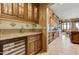 Convenient wet bar with wine cooler and glass-front cabinets at 18626 E Amarado Cir, Rio Verde, AZ 85263