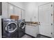 Bright laundry room features modern LG washer and dryer, granite countertop, and ample cabinetry at 23653 N 80Th Way, Scottsdale, AZ 85255