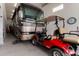 Garage with golf cart, RV, and extra storage at 29507 N 224Th Dr, Wittmann, AZ 85361