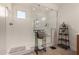 Spacious walk-in shower with glass enclosure and built-in seat at 29507 N 224Th Dr, Wittmann, AZ 85361