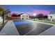 Night view of backyard with sports court and guesthouse at 30017 N 60Th St, Cave Creek, AZ 85331