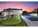 Expansive backyard with sports court, putting green, and basketball at 30017 N 60Th St, Cave Creek, AZ 85331