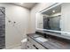 Modern bathroom with a large illuminated mirror and walk-in shower at 30017 N 60Th St, Cave Creek, AZ 85331