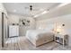 Bright bedroom with a comfortable bed, dresser, and access to a patio at 30017 N 60Th St, Cave Creek, AZ 85331