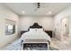 Bright bedroom with a queen-size bed and wood-look floors at 30017 N 60Th St, Cave Creek, AZ 85331